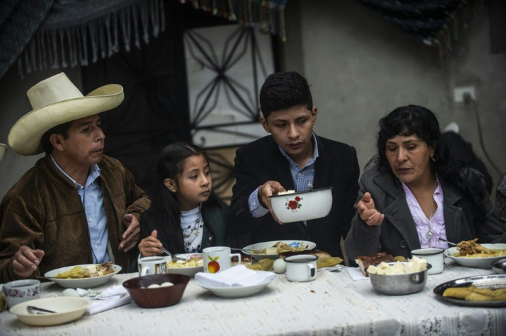 Peru's left-wing presidential candidate Pedro Castillo (left) took breakfast with his family before heading out to vote