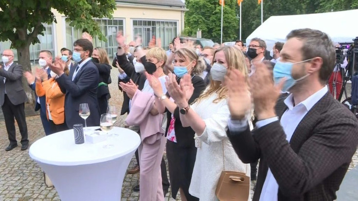 IMAGESSupporters of the German CDU party cheer during an election event at the announcement that Angela Merkel's conservatives scored a convincing win at state elections in Saxony-Anhalt. Exit polls show the CDU under new party chief Armin Laschet won bet