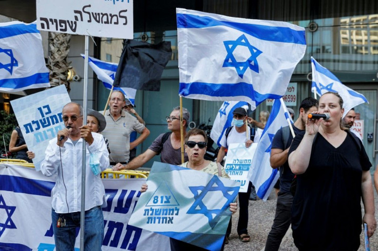 Supporters of Israel's newly-formed "change coalition" gather during a rally in the Israeli city of Tel Aviv on June 6