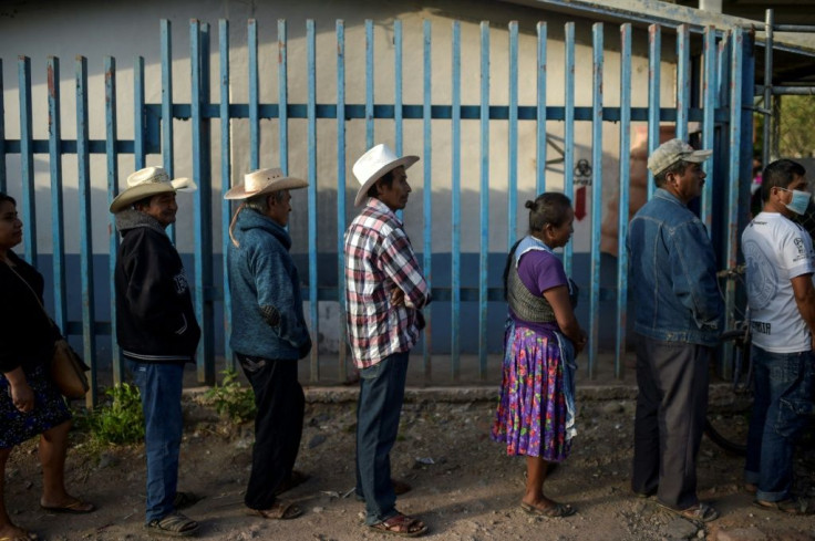 Mexicans queue to vote at a polling station in Atzacoaloya in the southern state of Guerrero