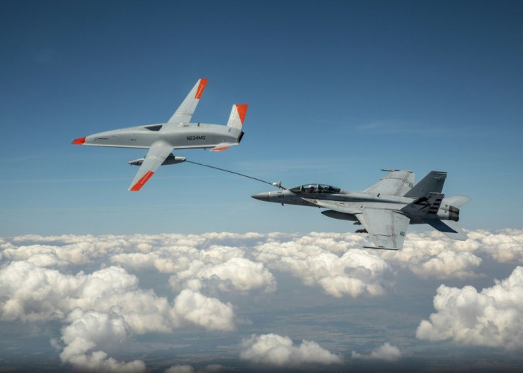 This Boeing handout photo obtained June 7, 2021 shows the Boeing MQ-25 T1 drone as it transfers fuel to a US Navy F/A-18 Super Hornet three days earlier