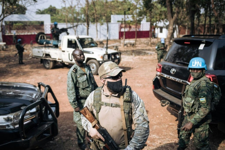 The United Nations Security Council has asked all forces in the Central African Republic to guarantee the safety of UN peacekeepers -- one is seen at right in 2020 in the capital Bangui