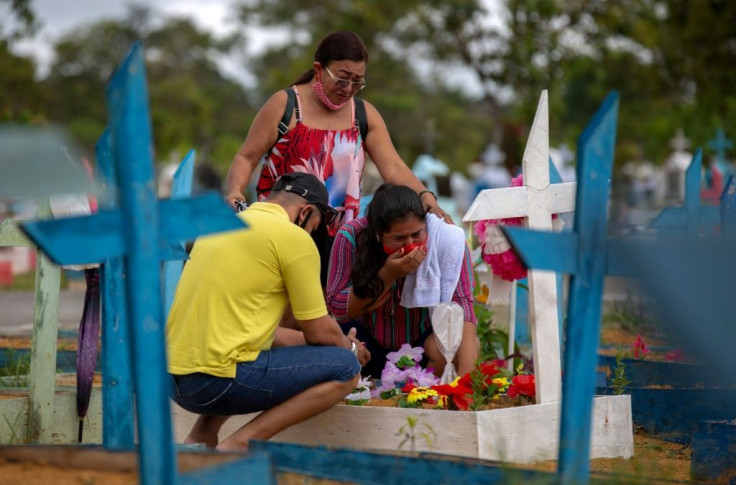 People visit the Nossa Senhora Aparecida cemetery in Manaus, Brazil amid the Covid-19  pandemic