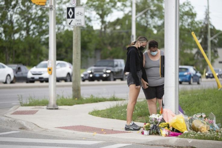 A Muslim family in London, Ontario, Canada were walking together along a sidewalk when a black pick-up truck "mounted the curb and struck" them as they waited to cross the intersection