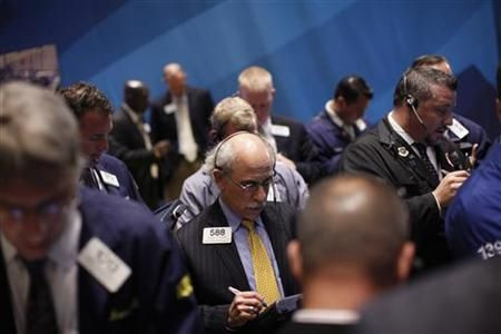 Traders work on the floor of the New York Stock Exchange