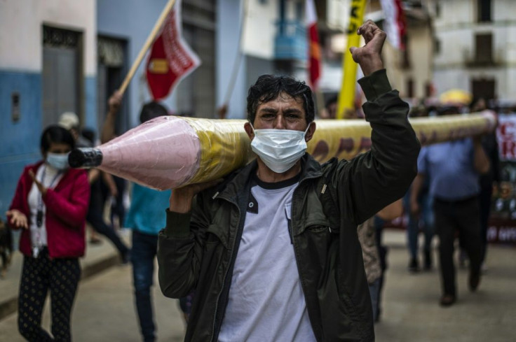 Castillo, a teacher, used a giant pencil as his campaign symbol