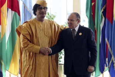 Libyan leader Gaddafi greets Algeria&#039;s President Bouteflika before opening of the African Union summit in Sirte