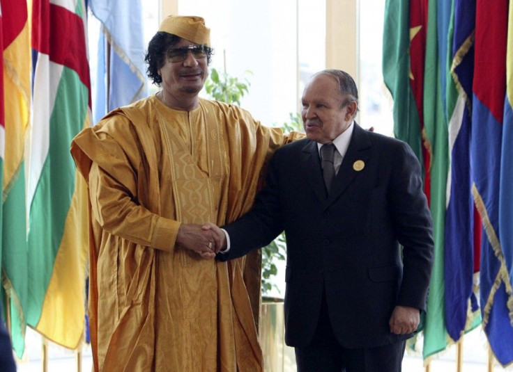 Libyan leader Gaddafi greets Algeria&#039;s President Bouteflika before opening of the African Union summit in Sirte