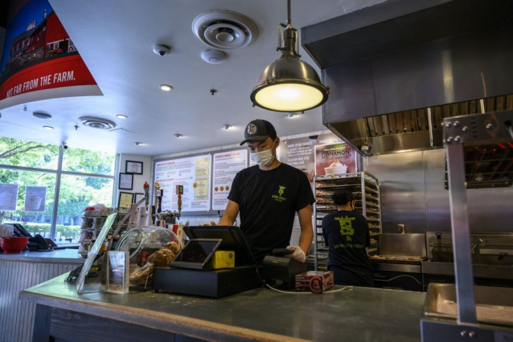 Togi, 16, started working in a fast food restaurant after his father lost his job during the Covid-19 pandemic