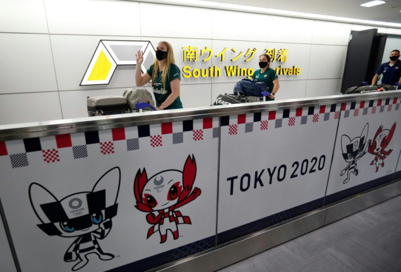 Members of Australia's Olympic softball team, the first to come to Japan for pre-Olympic training since the Olympic Games were postponed to 2021 due to Covid-19, arrive at Narita International Airport near Tokyo on June 1, 2021.