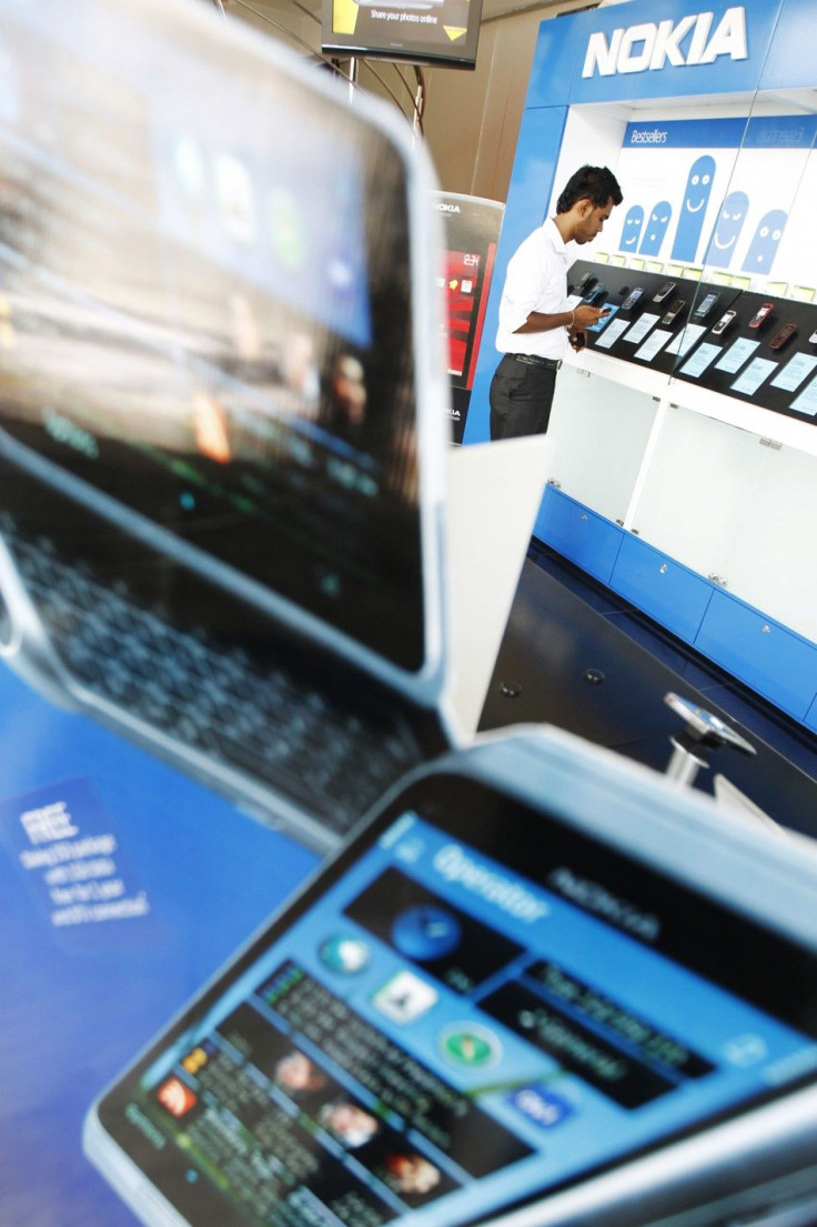 A customer looks at Nokia phones at a showroom run by Softlogic in Colombo