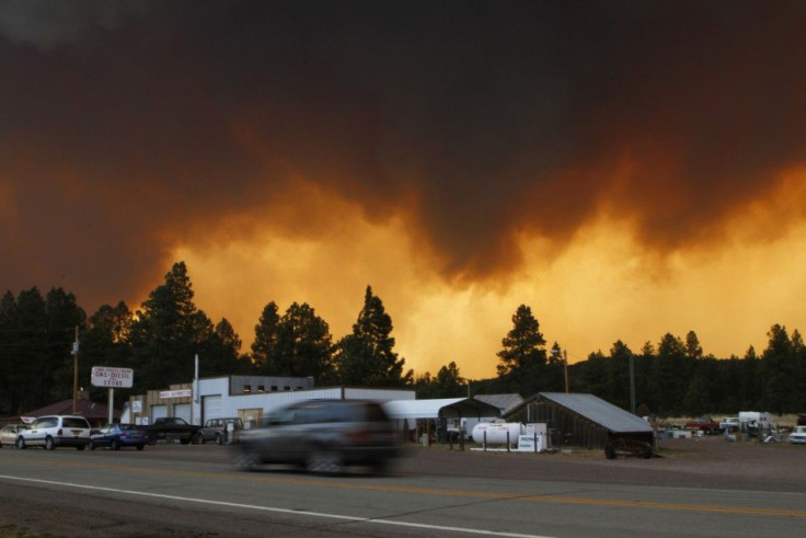 smoke from the Wallow Wildfire fills the sky in Luna, New Mexico June 6, 2011