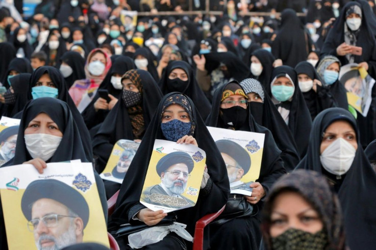 Raisi supporters attend a campaign rally in Eslamshahr, south of Tehran, on June 6