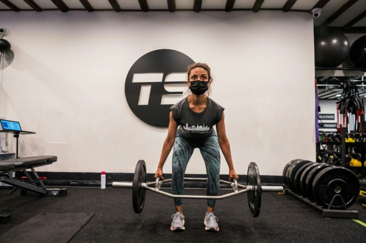 A woman works out at TS Fitness studio in New York