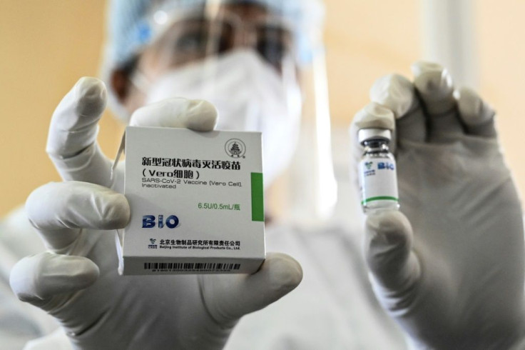 A health worker shows a vial of the Chinese-made Sinopharm vaccine in Colombo