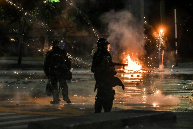 Riot police clash with demonstrators in Medellin