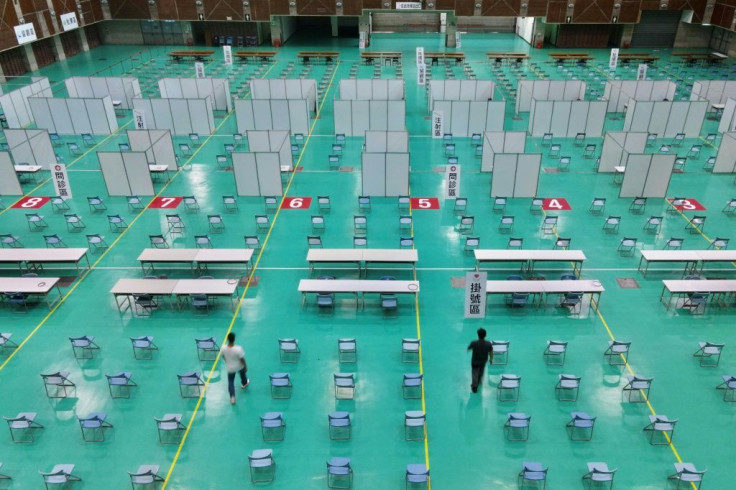 Authorities imposed a ban on migrant workers going outside after a coronavirus outbreak spread to the island's lucrative tech sector