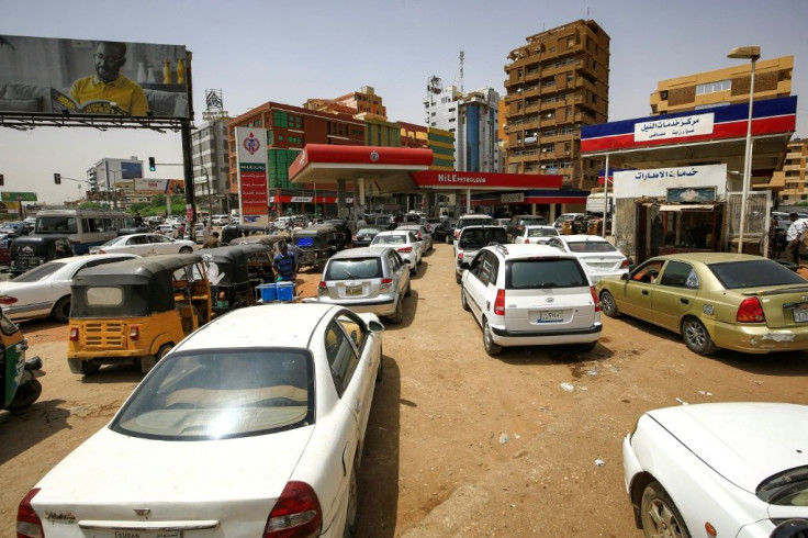 Sudanese queue up at petrol stations to fill up after the government decided to scrap subsidies on petrol and diesel, more that doubling prices