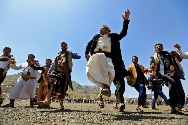 Yemeni fighters loyal to the Iran-backed Huthi rebels perform a traditional dance during a rally to express solidarity with the Palestinians in the capital Sanaa on May 20, 2021