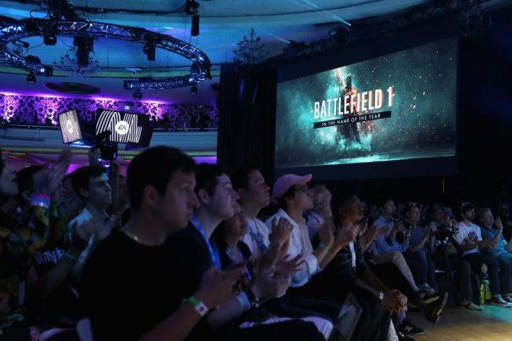 Game enthusiasts and industry personnel watch scenes from 'Battlefield One' during the Electronic Arts EA Play event on June 10, 2017 in Los Angeles, California