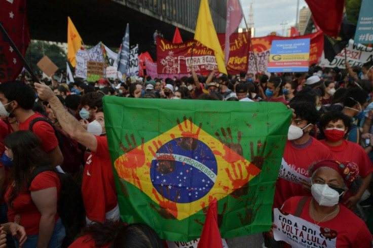 Marchers demonstrate against Brazilian President Jair Bolsonaro's handling of the COVID-19 pandemic in in Sao Paulo in late May 2021