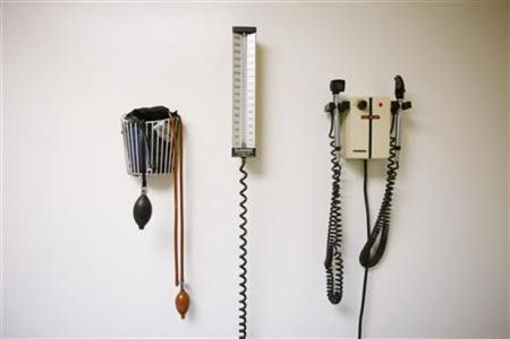 Devices used to take blood pressure, temperature, and examine eyes and ears rest on a wall inside of a doctor's office in New York in this March 22, 2010 file photo.