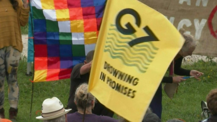 Extinction Rebellion stage a protest urging G7 to act on climate change.