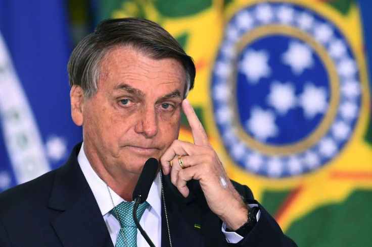 Brazilian President Jair Bolsonaro was booed by opponents when he boarded a plane