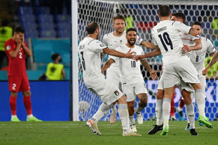 Lorenzo Insigne (C) celebrates Italy's third goal