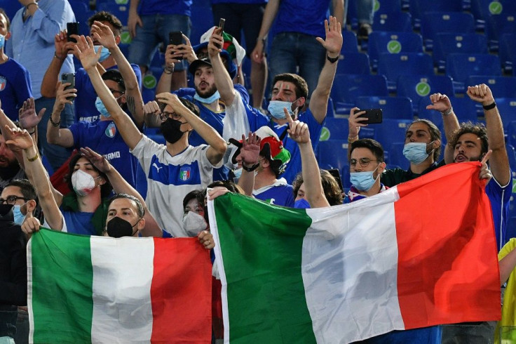Italy supporters celebrate after their team beat Turkey 3-0 in Rome in the opening game of Euro 2020 on Friday