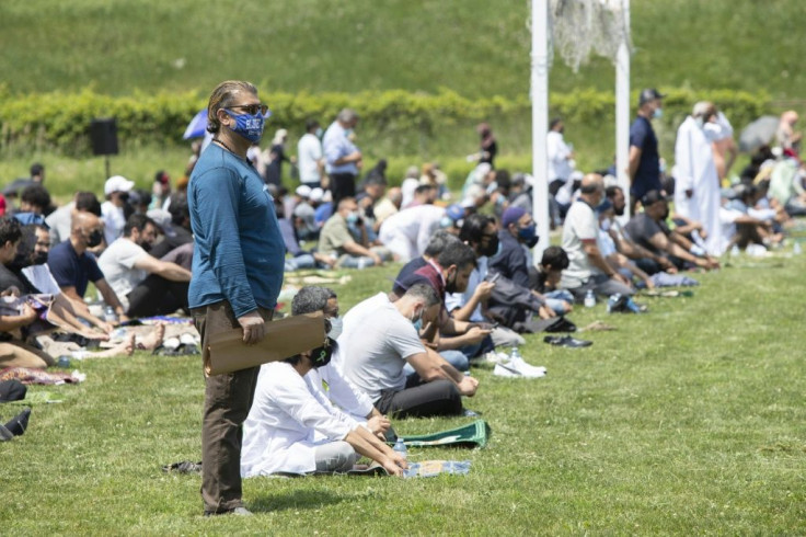 People gather at the Islamic Centre of Southwest Ontario on June 12, 2021, to pay their respects at the funeral of four members of the Afzaal family. A nine-year-old boy was seriously injured in the attack that killed his family