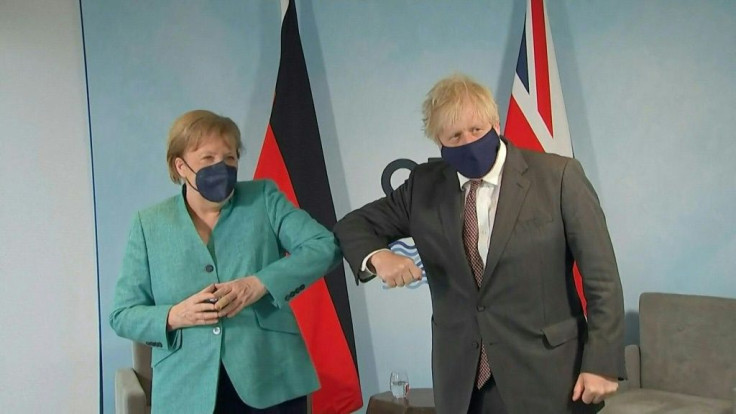 IMAGESGerman Chancellor Angela Merkel meets with Britain's Prime Minister Boris Johnson in Carbis Bay, southwest England, on the second day of the G7 summit.
