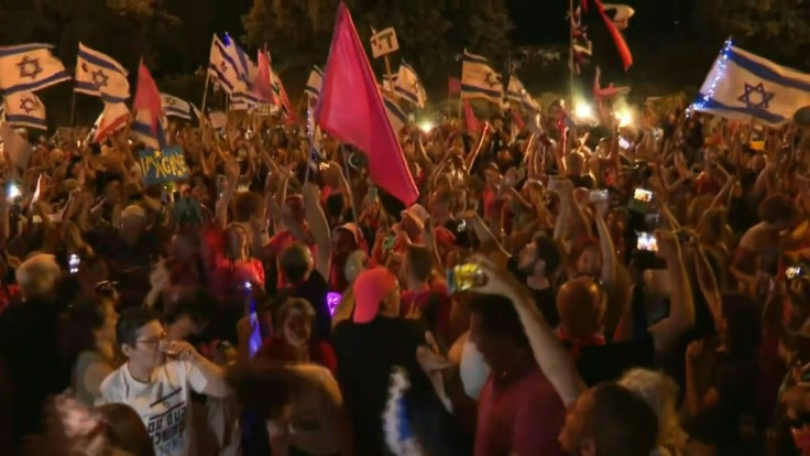 IMAGES People celebrate in Jerusalem after the Knesset voted on a coalition that ended Prime Minister Benjamin Netanyahu's 12 consecutive years in charge.