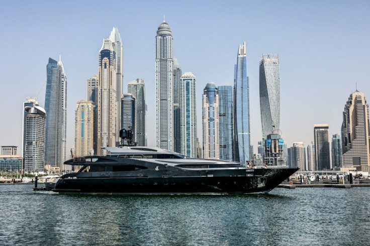 A luxury yacht is pictured off the Dubai Marina Beach on June 10 -- amid coronavirus, some have found time at sea a good way to meet friends