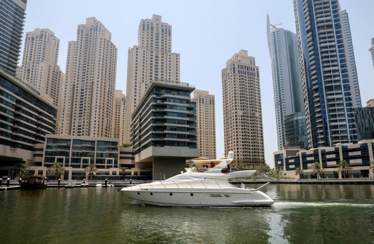 Dozens of white yachts are seen zipping through Dubai's bays, canals and islands