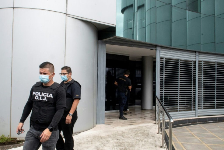 Police raided 14 government bureaus, including the Casa Presidencial and the Ministry of Public Works, as well as multiple private businesses and the homes of 21 people linked to the alleged network