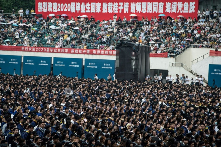 Almost 9,000 students, many of whom could not attend a graduation ceremony last year, gathered in Wuhan sans face masks and social distancing