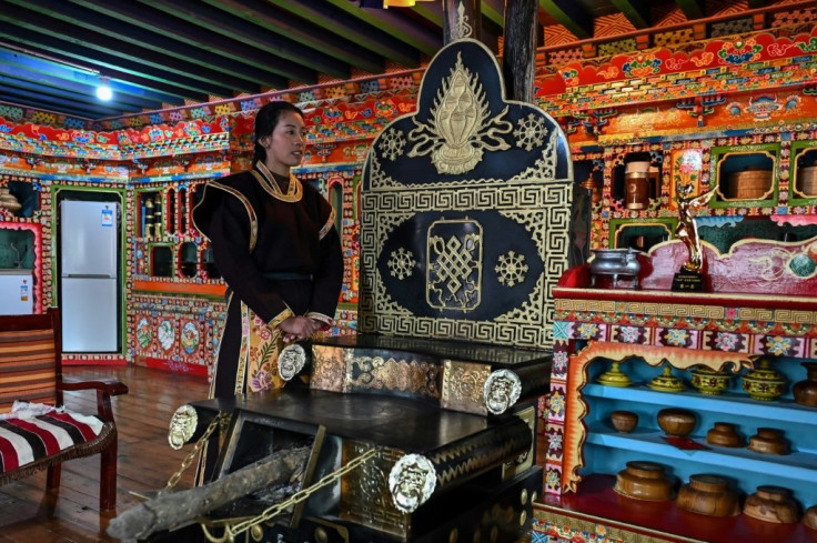 Baima shows off her hotel in the village of Tashigang during a government-organised media trip