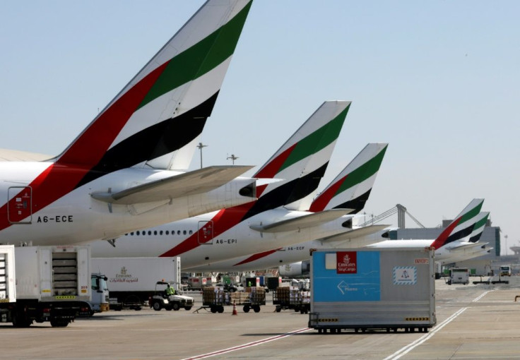 An Emirates Airlines Boing 777 plane unloads a coronavirus vaccine shipment at Dubai International Airport in this picture taken on February 1, 2021