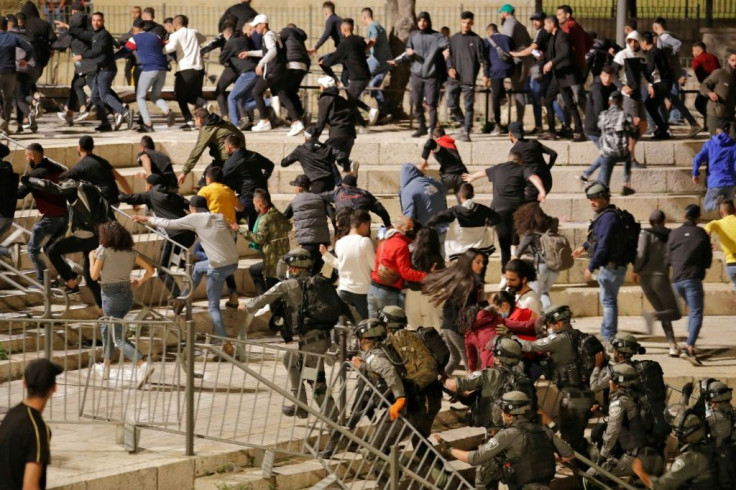 Israeli security forces disperse Palestinians protesting a march by far-right Jews into annexed east Jerusalem on April 22