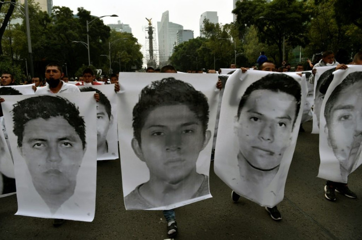 People protest in Mexico City in September 2020, to mark six years since the disappearance of 43 students in the city of Iguala