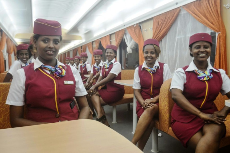 Stewardesses aboard a train on  Addis Ababa-Djibouti railway, one of the major infrastructure projects which Ethiopia borrowed heavily to fund
