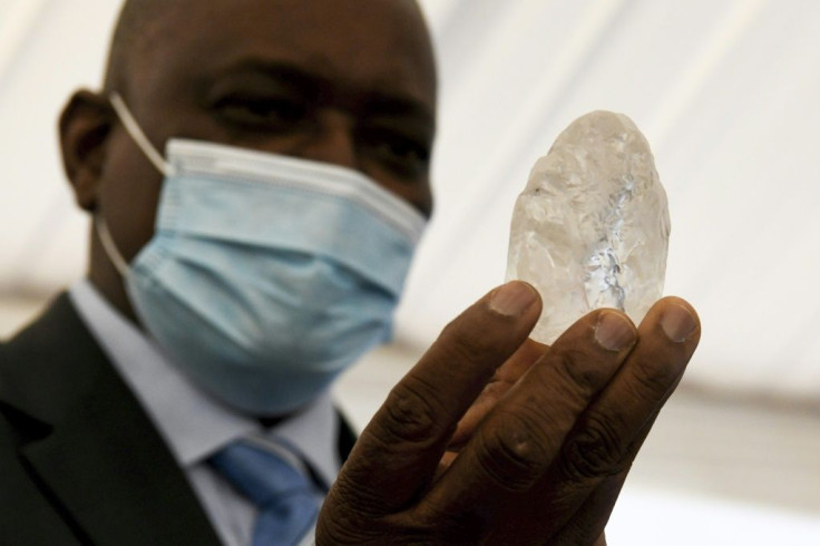Botswana President Mokgweetsi Masisi holds up the diamond, said to be the third largest of its kind