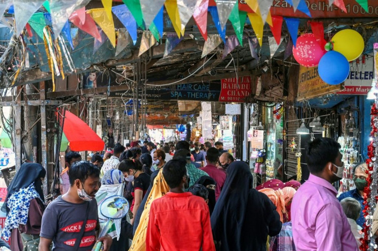 Crowds shop at a market in New Delhi after lockdown curbs are eased