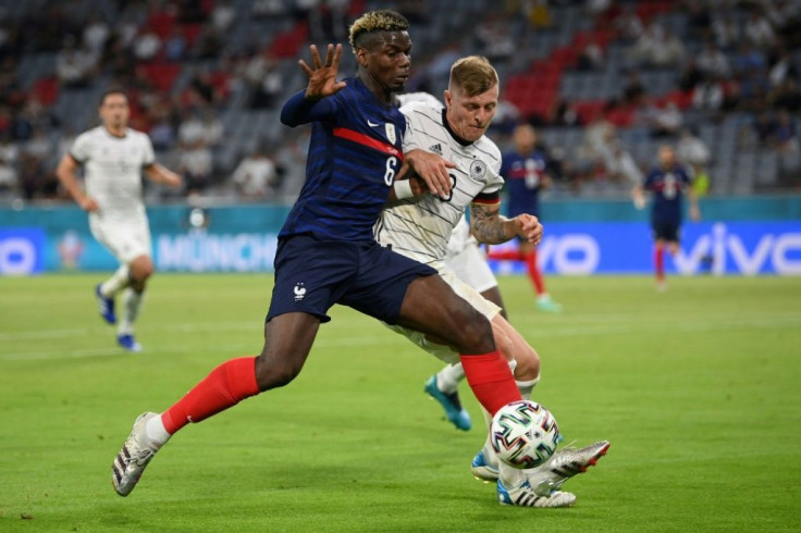 Paul Pogba holds off Toni Kroos during France's 1-0 win over Germany in Munich