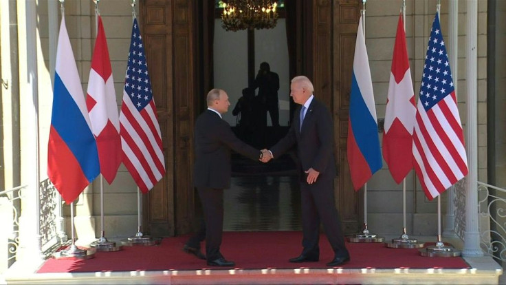 IMAGESUS President Joe Biden and his Russian counterpart Vladimir Putin shake hands in Geneva after standing with their host, Swiss President Guy Parmelin, at the start of their first summit.