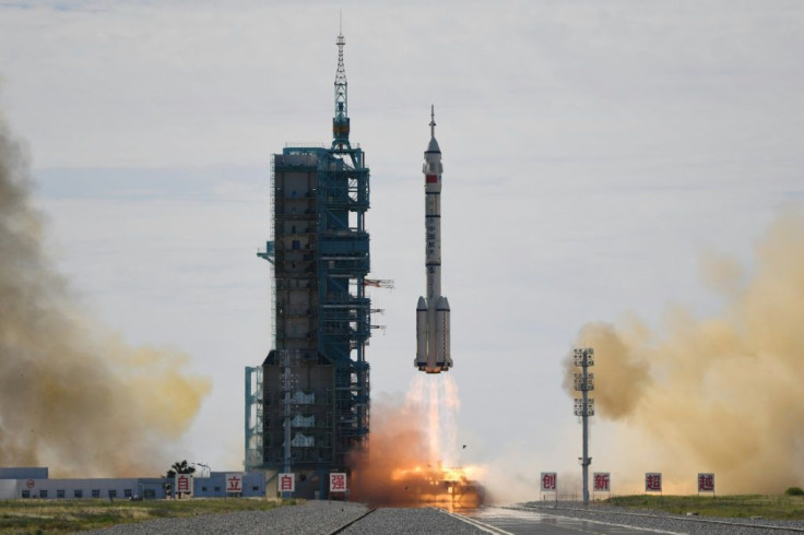 A Long March-2F carrier rocket, carrying the Shenzhou-12 spacecraft and a crew of three astronauts, lifts off from the Jiuquan Satellite Launch Centre in the Gobi desert, in northwest China