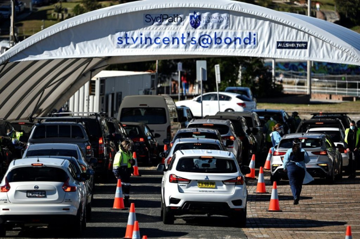 Health staff register residents at a Covid-19 coronavirus drive through testing site on Bondi Beach in Sydney on June 17, 2021