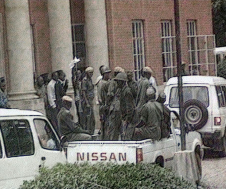 Kaunda waves a handkerchief at supporters outside court in January 1998, days after his arrest