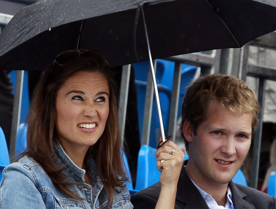 Pippa Middleton reacts before a rain break at the Queen039s Club Championships in west London